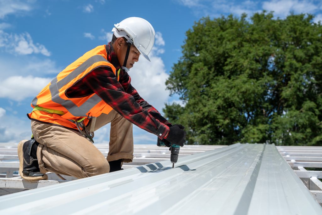 The Roofer technicians work and installing new roof structure on